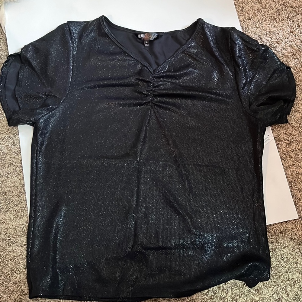 From the Elegant collection, gorgeous sparkling black top! Brand new with tags!